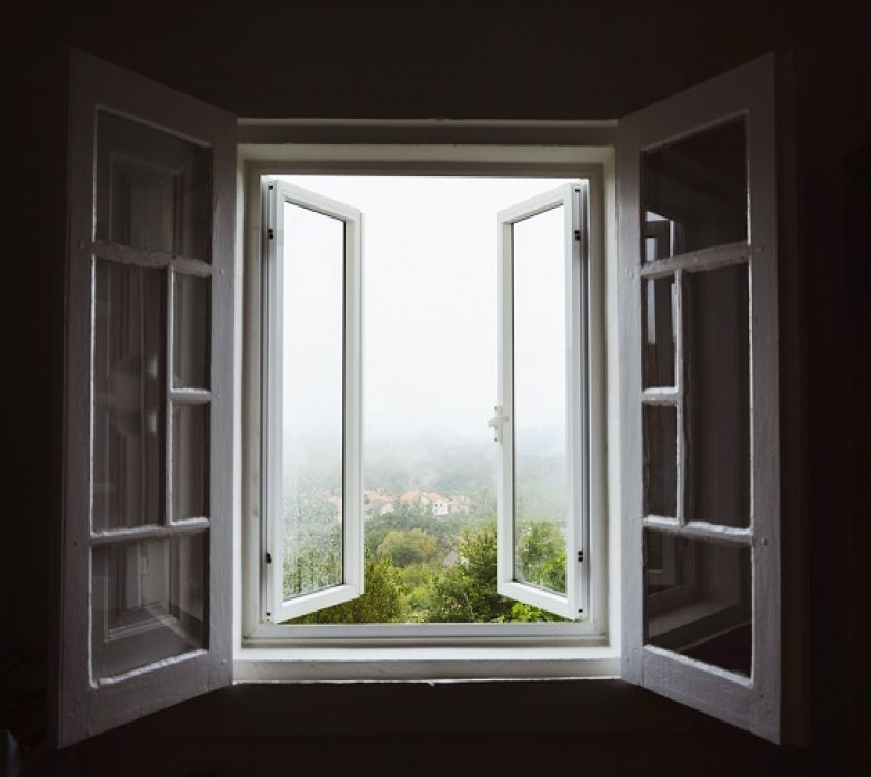Wide open window with amazing countryside view on foggy day. Stay home concept. Scenery view from the house. Travel to Spain and holidays concept. Open a window to air the room. Ventilate your house.